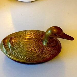 Solid brass container with duck motif